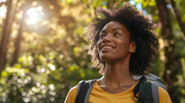 A woman enjoying a leisurely hike in nature to boost mood and energy.
