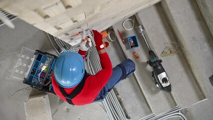 Electrician Installing Conduit in New Construction