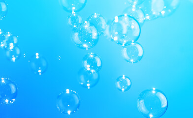 Beautiful Blue Soap Bubbles Floating in The Air. Celebration Festive Backdrop. Freshness Soap Suds Bubbles Water. Abstract Blue Textured Background.	
