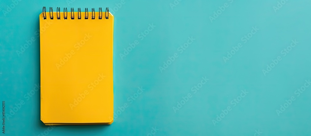Aufkleber close up of yellow note pad isolated on pastel background. with copy space image. place for adding t