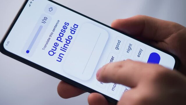 Learning a foreign language online. Studying online using e-learning application on a smartphone. Online language quiz. Fictional Interface.