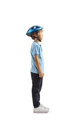 Full length profile shot of a boy with a blue bicycle helmet