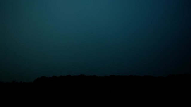 Real Thunder Lightning filmed in the sky by night, flashes in the darkness, thunderbolt storm with lightning bolt, thunderstorm.