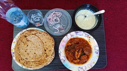 fried ladyfinger salad raita and lassi wheat roti chapatti