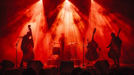 Silhouetted musicians playing instruments on a stage, with dramatic backlighting.