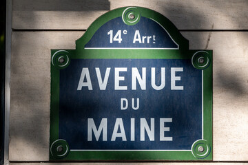 Typical street sign in the city of Paris (Avenue du Maine)
