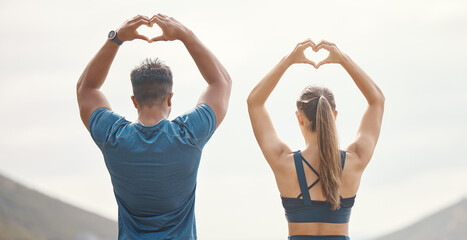Couple, back and heart hands in outdoor for fitness or love for training, healthcare and wellness or wellbeing. Man, woman and together with sign for expression of support, motivation and marathon.