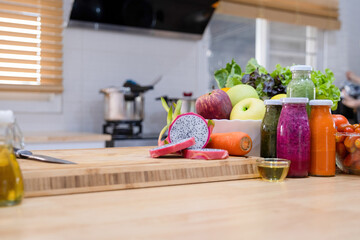 Counter with healthy ingredients and vegetables.