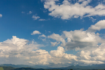 The most beautiful landscape in the mountains, the sky with clouds on a sunny day.