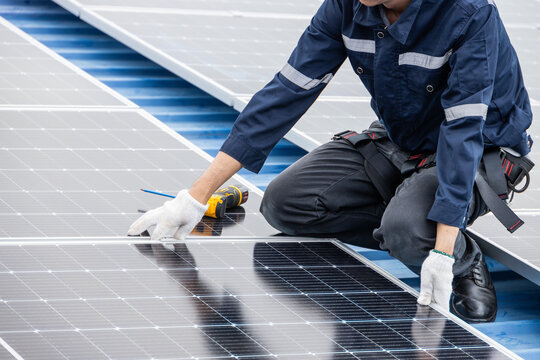 Professional Engineer Service Solar Panel. Worker Maintenance Cleaning Replacing Solar Panel. Solar photovoltaic panel system in Industry roof. Saving Energy with Clean Power.