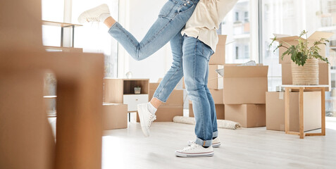 Happy, legs and couple hug in new house success, real estate and love for gratitude of property investment. Care, woman and man with embrace, support and bonding for homeowner security celebration