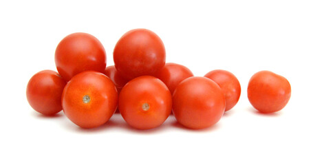 Mini black, red, and yellow tomatoes isolated on white