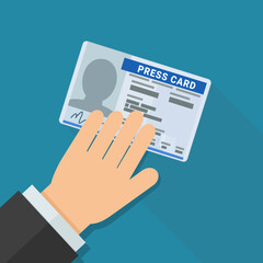A hand presents a press card on blue background with long shadow in flat design style