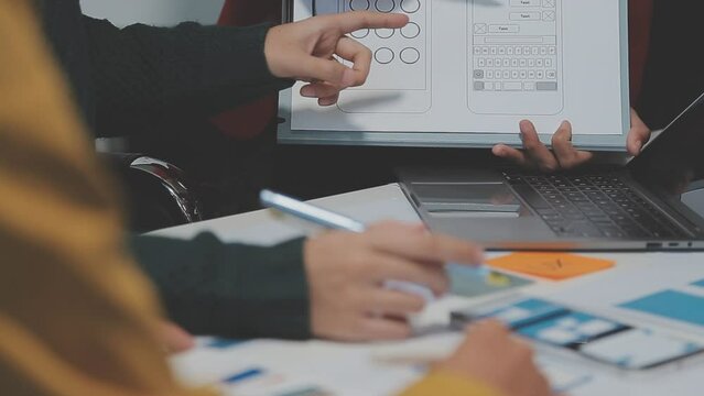 Young Asian woman leading business creative team in mobile application software design project. Brainstorm meeting, work together, internet technology, girl power, office coworker teamwork concept