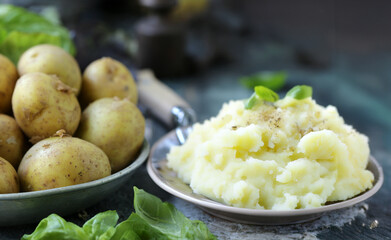 organic fresh potatoes for mashing on wooden table