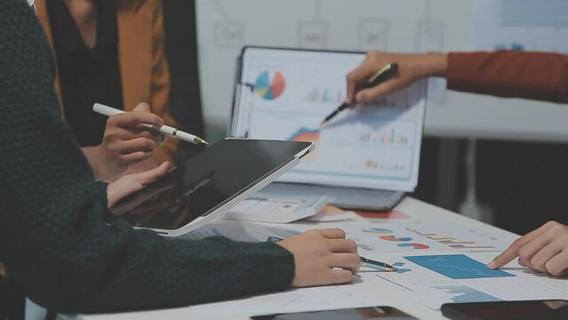 Young Asian woman leading business creative team in mobile application software design project. Brainstorm meeting, work together, internet technology, girl power, office coworker teamwork concept