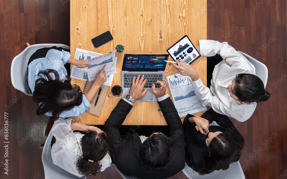 Wall mural panorama top view diverse group of business analyst team analyzing financial data report paper on me