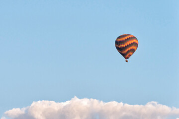 Hot air balloon over the clouds