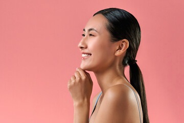 Facial proportion changes.Beautiful asian woman with neat hairstyle keeping chin in hand and...