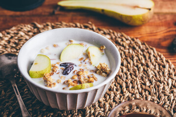 Bowl of Granola with Pear and Raisins for Breakfast
