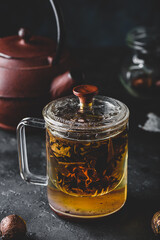 Steeping red tea in glass mug