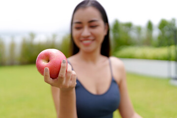 Young woman eating an apple for diet, healthy lifestyle