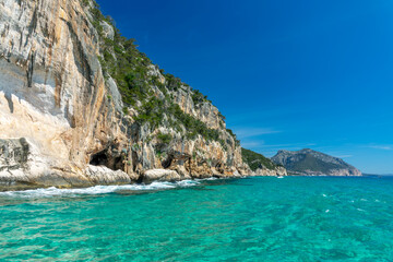 Obraz premium Cliffs and clear transparent blue water in the Gulf of Orosei, Sardinia island, Italy