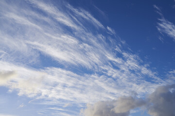 Nature, blue sky and streak of clouds as background for natural beauty, atmosphere and weather. Wallpaper, sunshine and scenic view in air for environment, heaven and cloudscape in morning outdoors