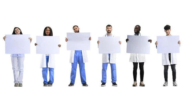 A group of doctors, full-length, on a white background, with a white sheet