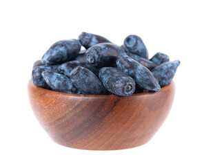 Honeysuckle in wooden bowl, isolated on white background. Fresh honeysuckle blue berry fruits. Clipping path.