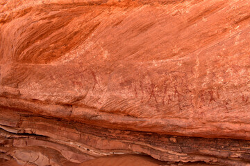 Hunters with spears - prehistoric petroglyph, rock art at Tadrart Rouge, Tadrart Akkak, Sahara, Algeria, horizontal view