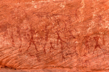 Hunters with spears - prehistoric petroglyph, rock art at Tadrart Rouge, Tadrart Akkak, Sahara, Algeria, horizontal view