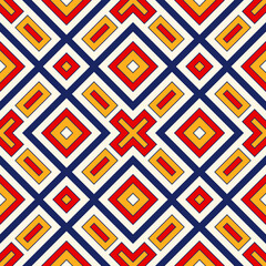 Bright ethnic abstract background. Seamless pattern with symmetric geometric ornament. Ornamental vivid wallpaper. Vector illustration