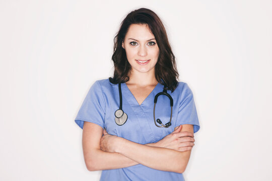 Medical: Smiling Nurse Against White Wall