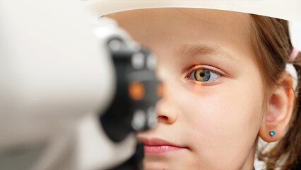Eye iris and pupil macro. Reflected moving light rays into the child eye with zoom. Close up. The...