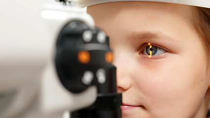 Eye iris and pupil macro. Reflected moving light rays into the child eye with zoom. Close up. The...