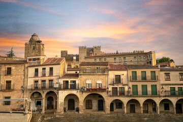 Fototapeta premium View of one of the arcaded sides of the Plaza Mayor of Trujillo, Cáceres, Extremadura, Spain, with the medieval citadel in the background