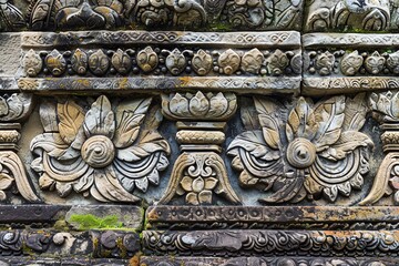 Intricate stone carvings adorn an ancient temple wall, featuring floral motifs and intricate details.