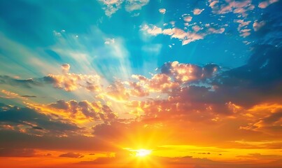 Fototapeta premium A stunning sunset with vivid blue, orange, and yellow colors blending seamlessly across the sky, evoking a sense of peace and wonder