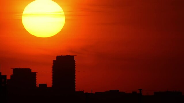 4k video of majestic sunset landscape horizon. Amazing sun light of nature foggy sky with skyscrapers colorful dark sunset clouds footage. Nature environment background