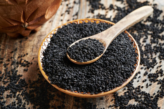 Black cumin or Nigella sativa seeds in a bowl. Healthy nutritional supplement.