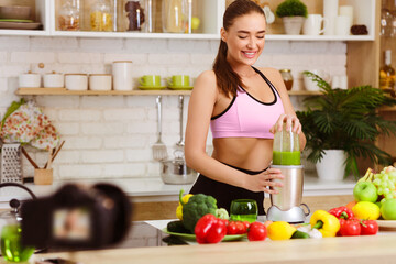 Food Blogger. Slim Woman Making Smoothie And Recording Video For Her Blog