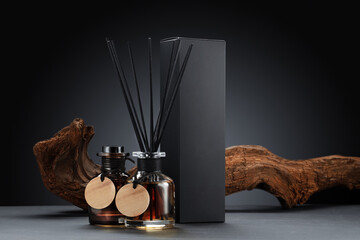 Stylish aroma diffuser set with wooden accents on dark background