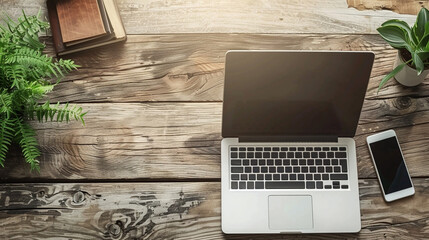 Rustic wooden desk with laptop, phone, potted plants. Laptop is open with screen facing up, phone is lying flat on desk