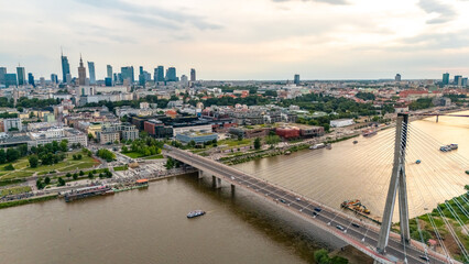 Fototapeta premium panoramic aerial view of Warsaw city at sunset in summer over the river