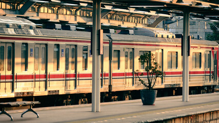 View of a train station, one is stopping