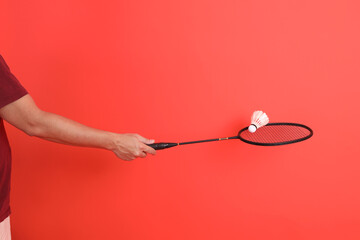  hand holds Badminton racket
