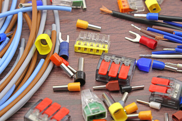 Materials for electrical installation work during the assembly of electrical equipment. Close-up. Soft focus.