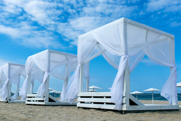 beach canopies with white curtains © sabbra_cadabra