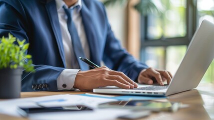 Businessman  analyzing financial reports at office desk